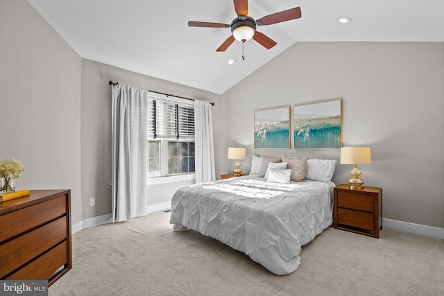 carpeted bedroom with vaulted ceiling and ceiling fan