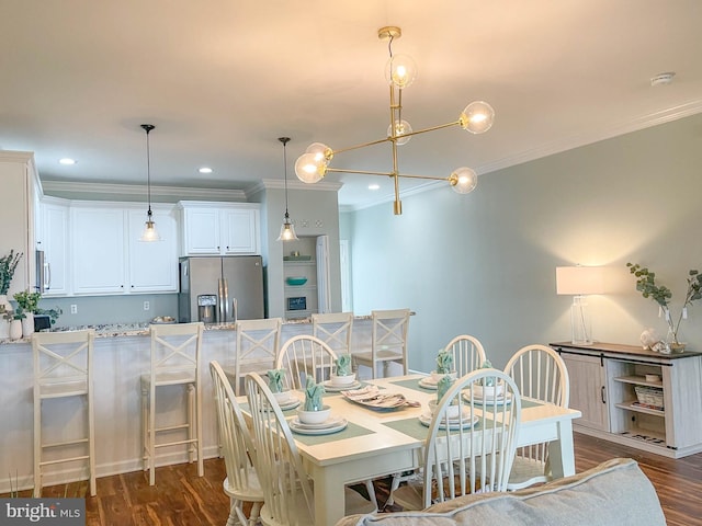 dining space with ornamental molding and dark hardwood / wood-style flooring