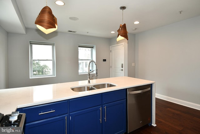 kitchen featuring pendant lighting, light countertops, a sink, blue cabinets, and dishwasher