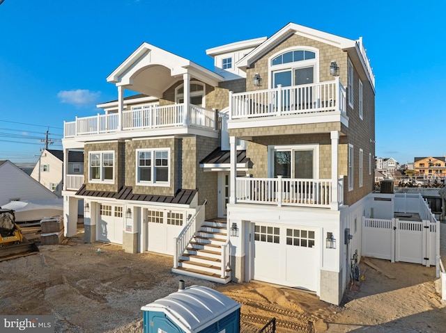 view of front of house with a garage and a balcony