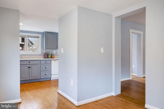 interior space with light wood-type flooring and baseboards