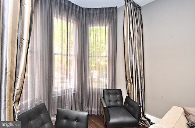 living area with hardwood / wood-style flooring