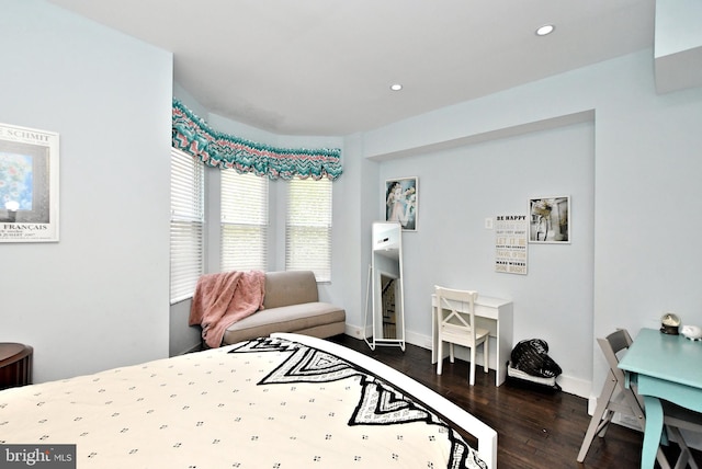 bedroom with dark wood-type flooring