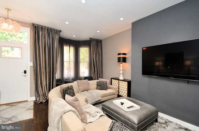 living room featuring plenty of natural light and wood-type flooring