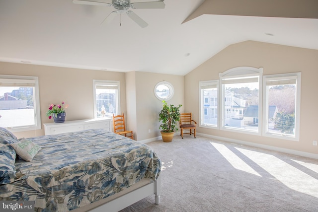 bedroom with a ceiling fan, lofted ceiling, light colored carpet, and baseboards