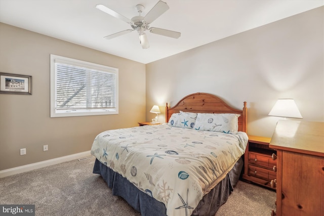 bedroom with carpet, baseboards, and a ceiling fan