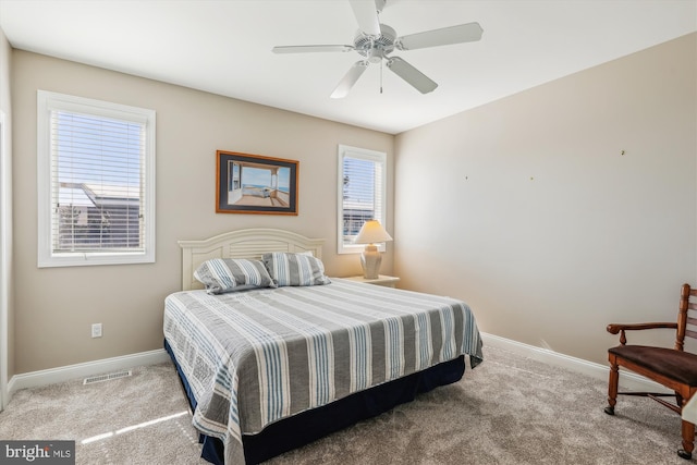 bedroom featuring visible vents, baseboards, and carpet flooring