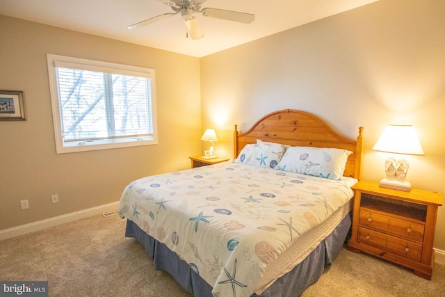 bedroom with a ceiling fan, carpet, and baseboards