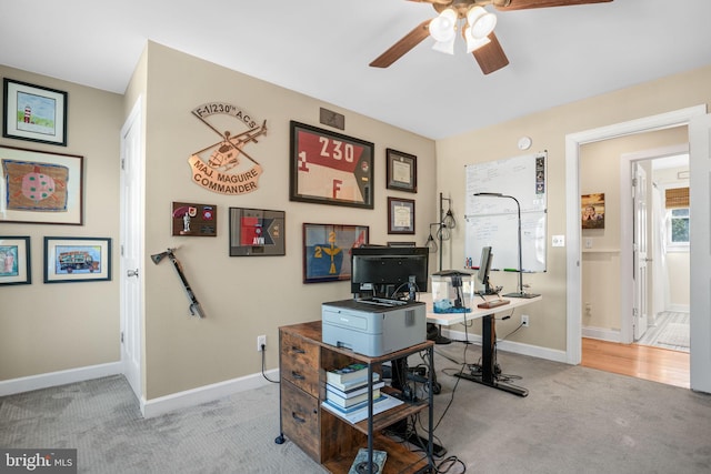 office space with ceiling fan, carpet flooring, and baseboards