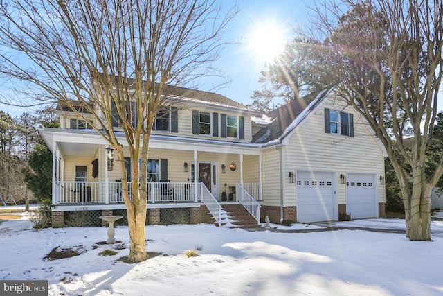 view of front of house featuring a garage and a porch