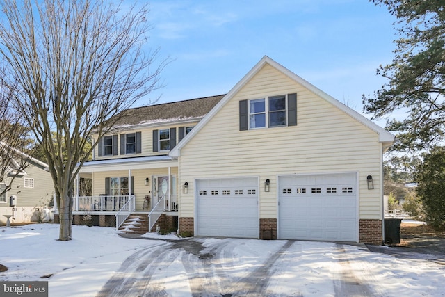 traditional-style home with a porch, brick siding, and a garage