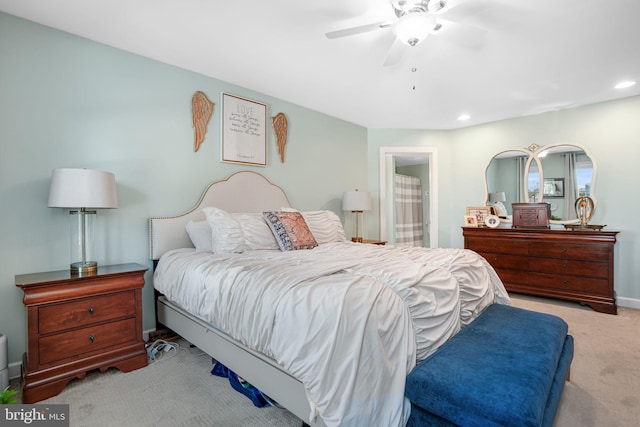 bedroom featuring ensuite bathroom, recessed lighting, a ceiling fan, baseboards, and carpet