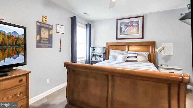 bedroom with a ceiling fan, visible vents, and baseboards