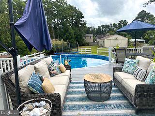 pool featuring an outdoor hangout area