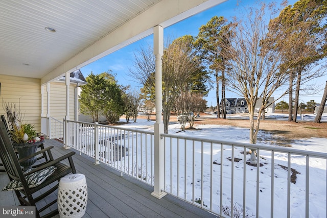 view of snow covered deck