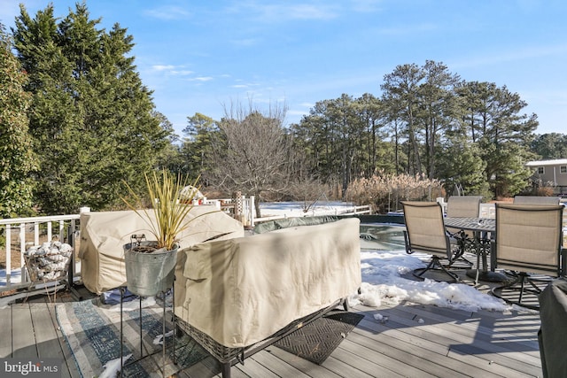 deck featuring outdoor dining area