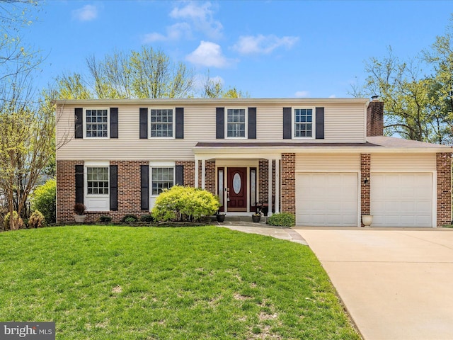 traditional-style house featuring brick siding, a front yard, and concrete driveway