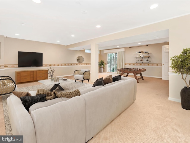 living area with recessed lighting, baseboards, and light colored carpet