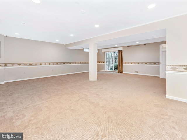 basement featuring light carpet and recessed lighting