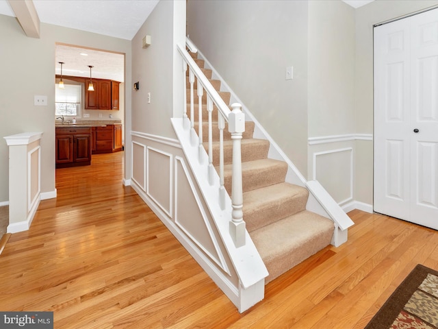 staircase featuring wood finished floors