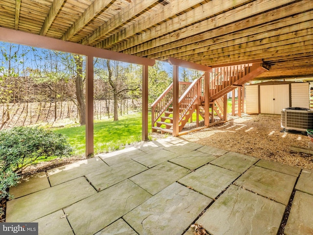 view of patio / terrace with stairs and central AC unit