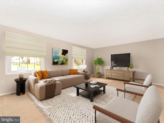 carpeted living area with baseboards
