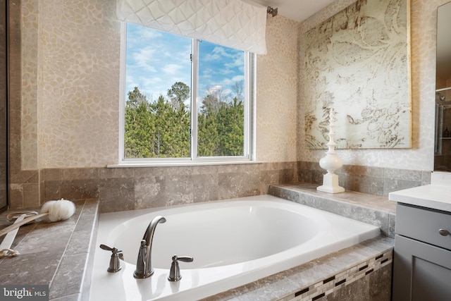 bathroom featuring a bath and vanity