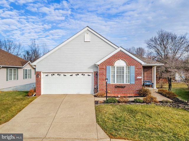 view of front of property featuring a front yard and a garage