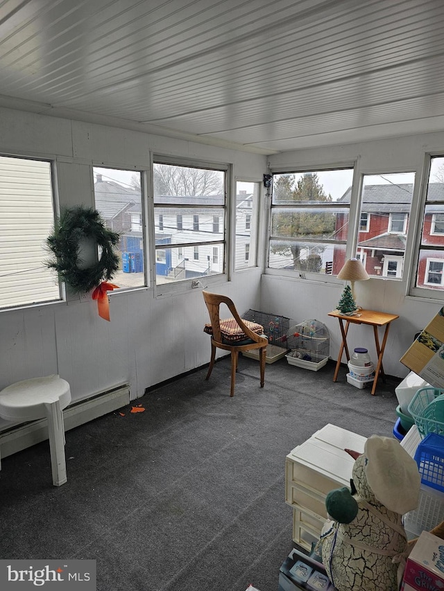 sunroom / solarium featuring baseboard heating