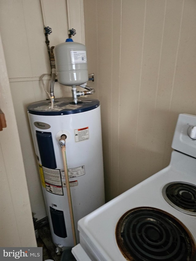 utility room featuring water heater