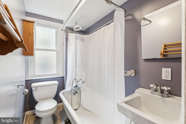 bathroom featuring sink and toilet