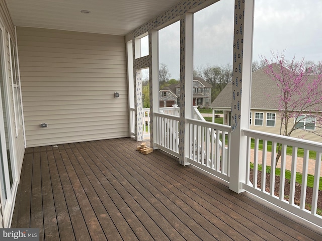 wooden deck with a residential view