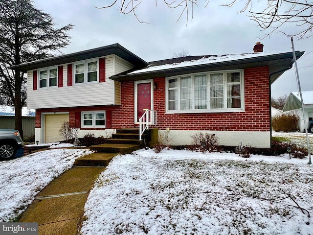 split level home featuring a garage