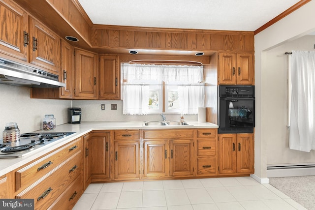 kitchen featuring gas cooktop, crown molding, sink, black oven, and a baseboard heating unit