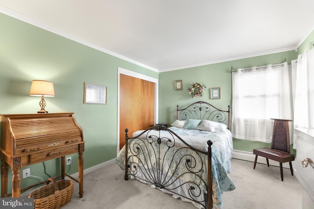 bedroom with a closet, crown molding, and light colored carpet