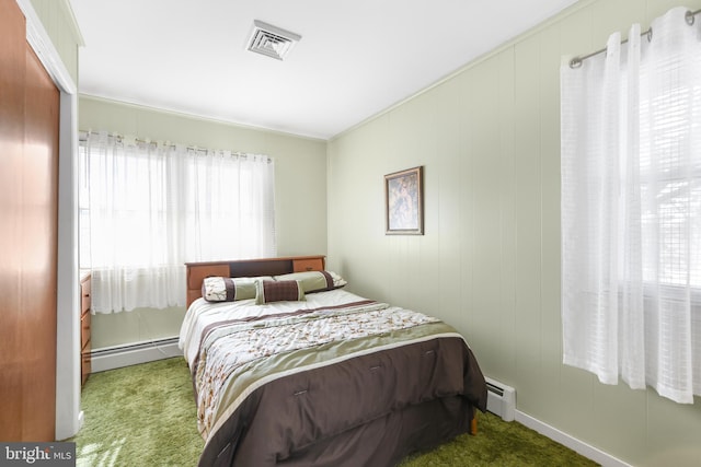 carpeted bedroom featuring a baseboard radiator