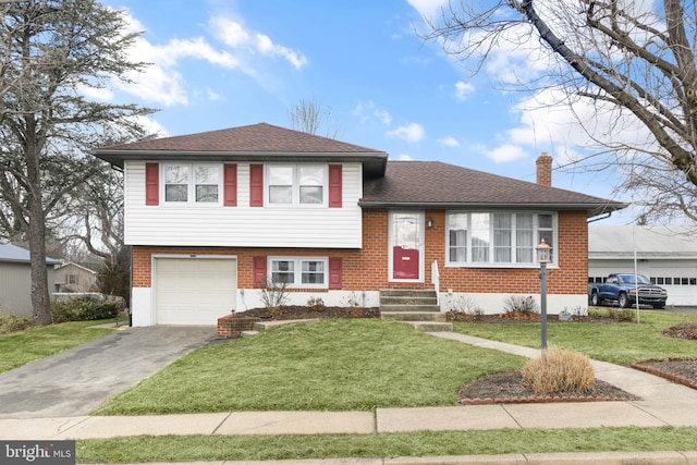 tri-level home featuring a garage and a front lawn