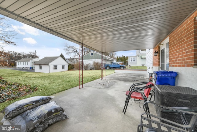 view of patio / terrace featuring an outbuilding