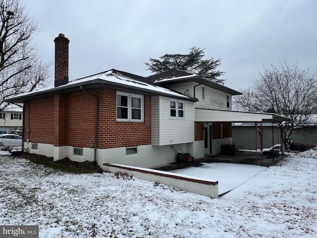 view of snow covered house