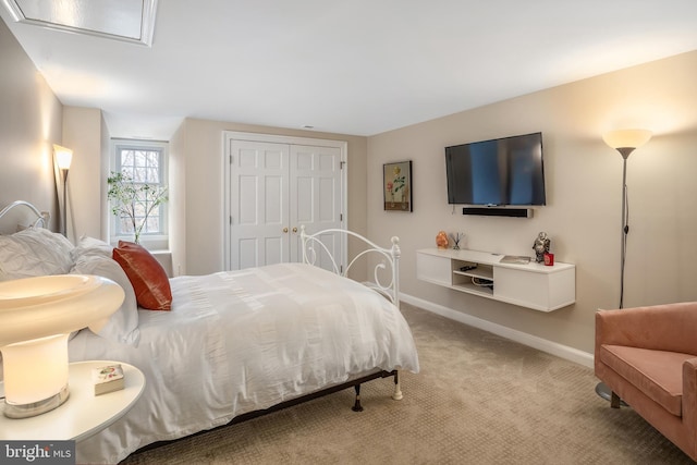 carpeted bedroom featuring a closet