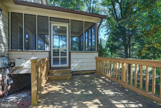 wooden terrace with a sunroom