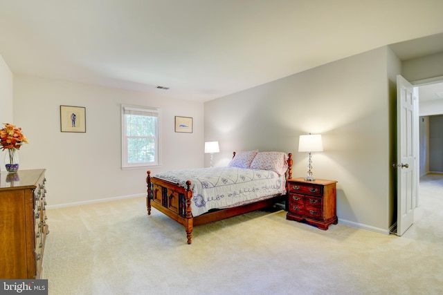 bedroom with light colored carpet