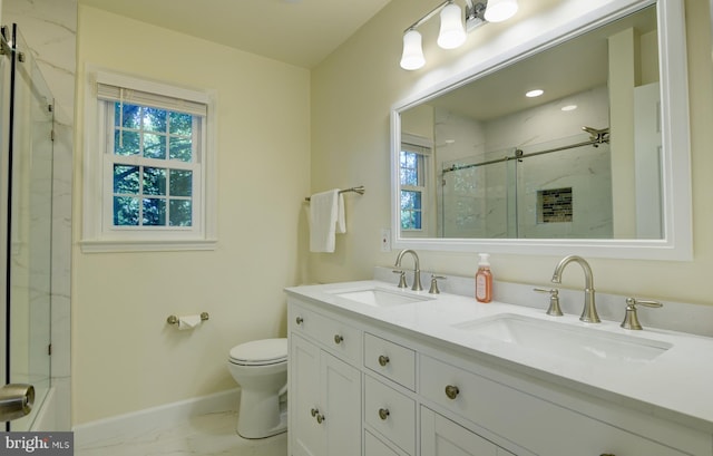 bathroom featuring vanity, toilet, and walk in shower