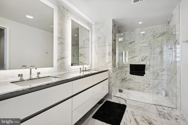 bathroom with vanity and a shower with shower door