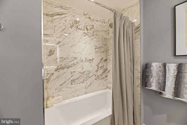 bathroom featuring shower / tub combo with curtain