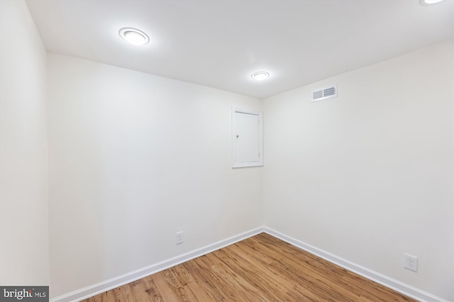 spare room with hardwood / wood-style flooring