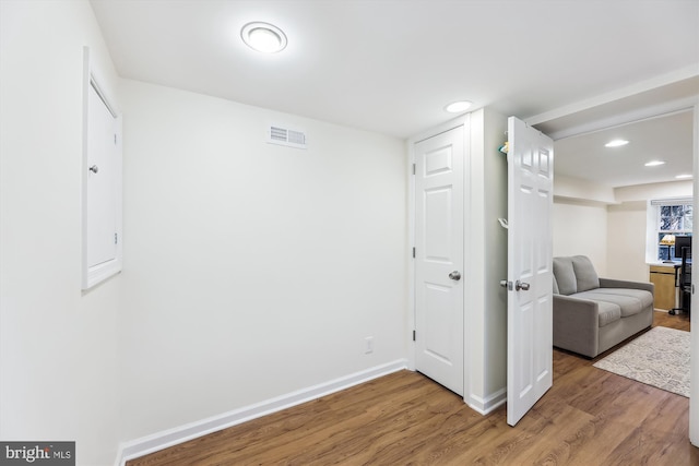 unfurnished room featuring hardwood / wood-style floors