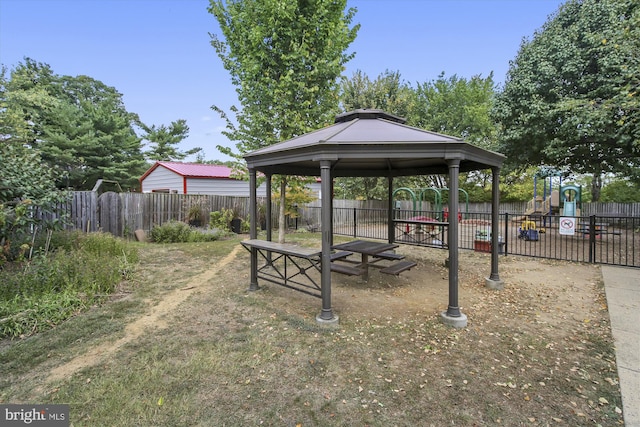 exterior space with a playground and a gazebo