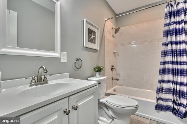 full bathroom with vanity, toilet, and shower / tub combo