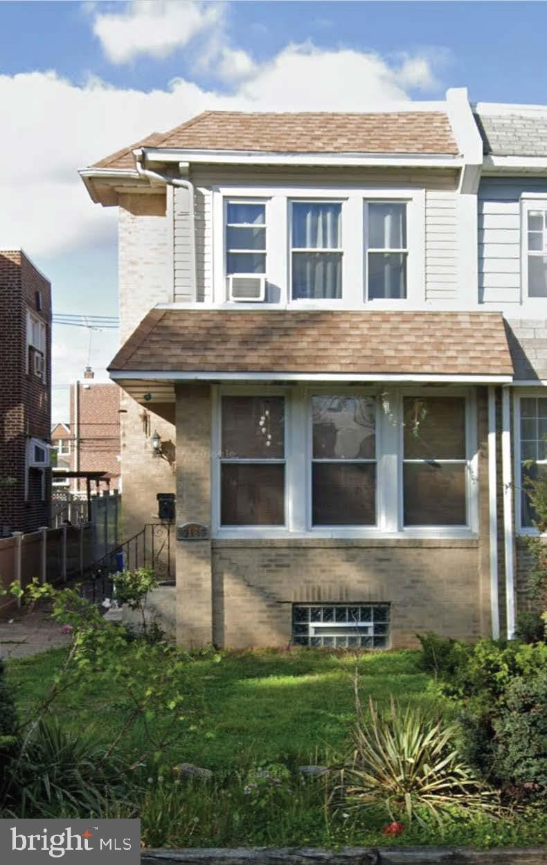 view of home's exterior with cooling unit and a yard